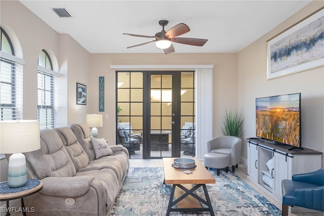 living room with french doors and ceiling fan