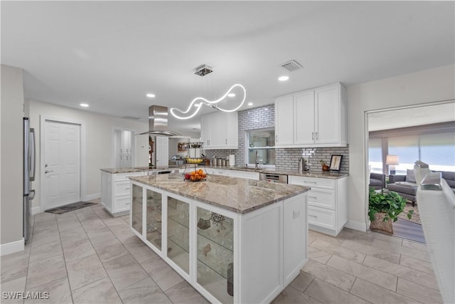 4476 Windjammer Ln, Fort Myers, FL 33919 - kitchen featuring visible vents, white cabinetry, a peninsula, extractor fan, and appliances with stainless steel finishes