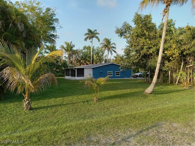 view of yard with a sunroom