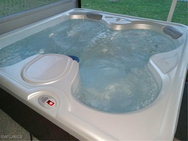 view of pool with sink and a hot tub