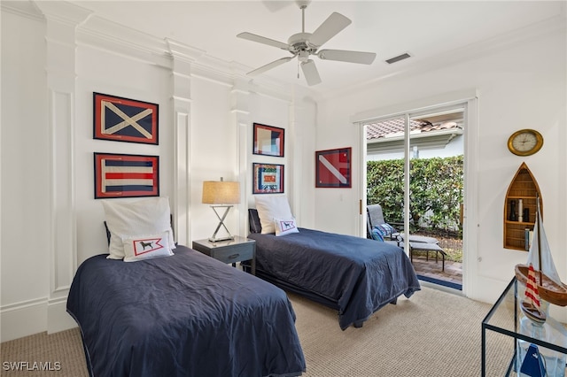 carpeted bedroom featuring ceiling fan, ornamental molding, and access to exterior