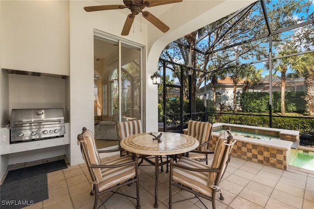 sunroom with a healthy amount of sunlight and ceiling fan