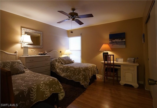 bedroom featuring wood finished floors and a ceiling fan