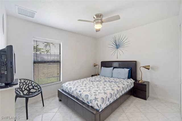 bedroom featuring light tile patterned flooring and ceiling fan