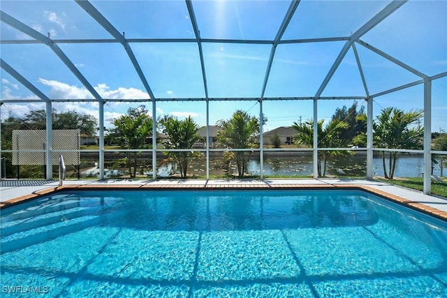 view of swimming pool with a lanai