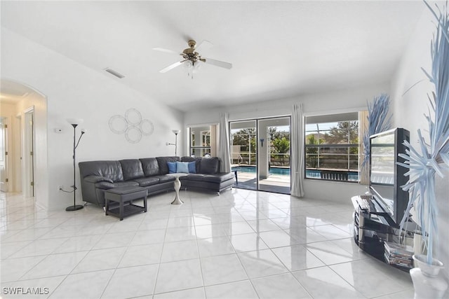 tiled living room with ceiling fan