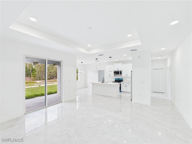 621 Allison St E, Lehigh Acres, FL 33974 - unfurnished living room with a tray ceiling, recessed lighting, baseboards, marble finish floor, and a sink