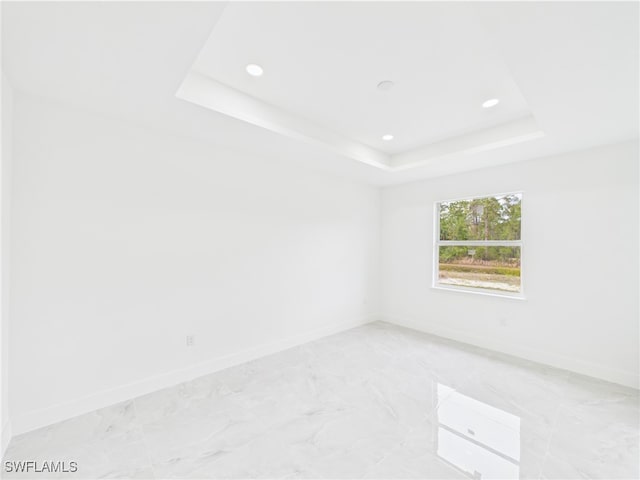 621 Allison St E, Lehigh Acres, FL 33974 - spare room featuring baseboards, marble finish floor, and recessed lighting