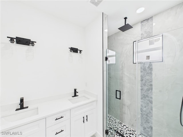 621 Allison St E, Lehigh Acres, FL 33974 - bathroom featuring a stall shower, recessed lighting, visible vents, and a sink
