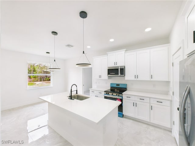 621 Allison St E, Lehigh Acres, FL 33974 - kitchen with white cabinets, light countertops, stainless steel appliances, and a sink