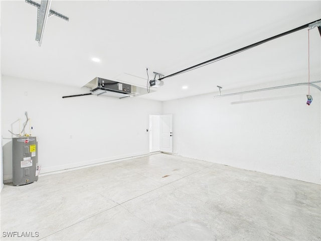 621 Allison St E, Lehigh Acres, FL 33974 - garage featuring recessed lighting, water heater, and a garage door opener
