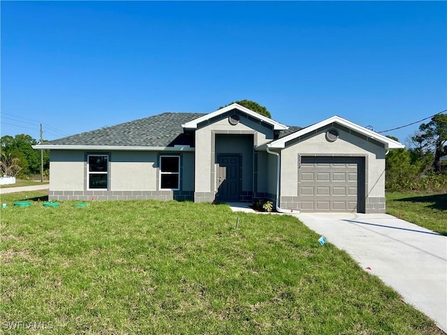 ranch-style house with a garage and a front lawn