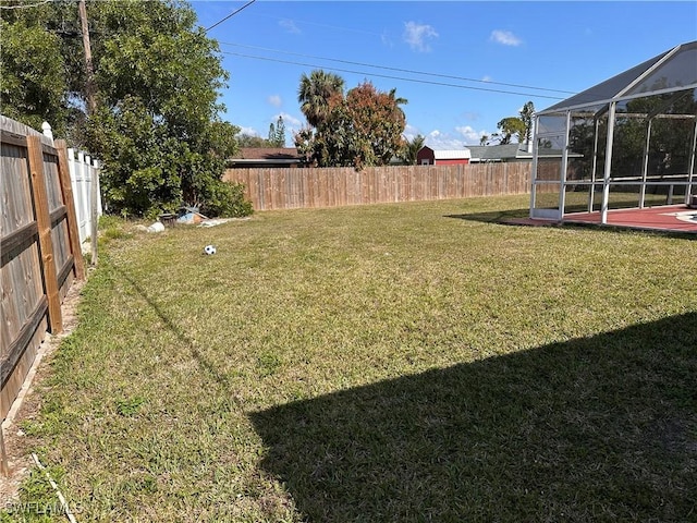 view of yard featuring a lanai