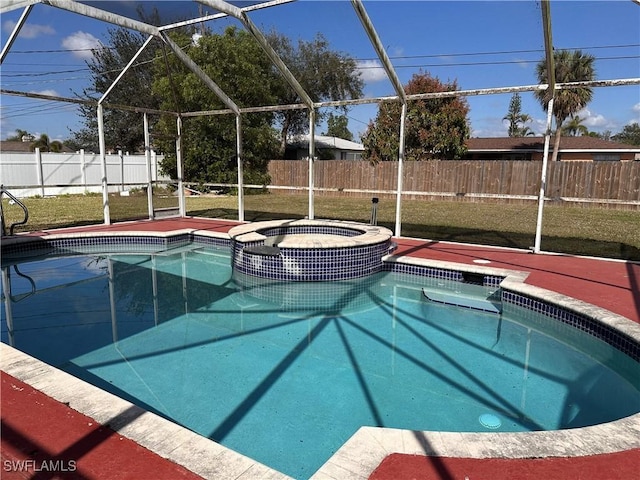 view of swimming pool with a yard, a lanai, and an in ground hot tub