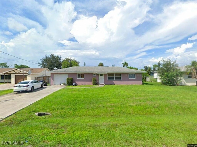 ranch-style home featuring a garage and a front lawn