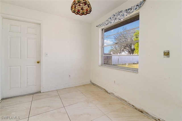 empty room with baseboards