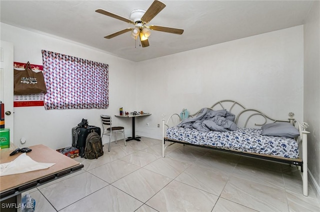 bedroom featuring a ceiling fan and tile patterned flooring