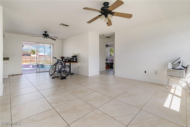 spare room featuring visible vents, baseboards, and light tile patterned flooring