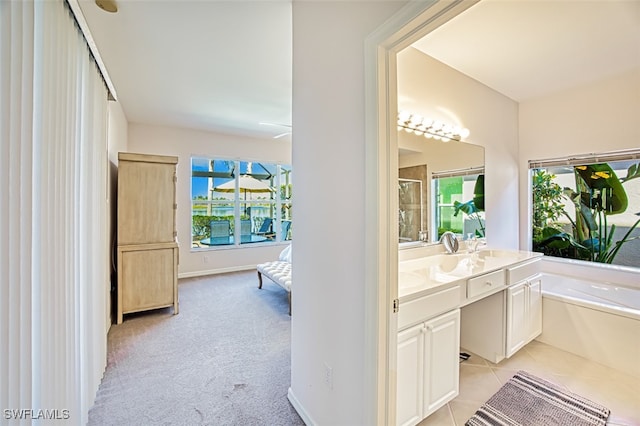 bathroom featuring vanity, tile patterned flooring, and independent shower and bath