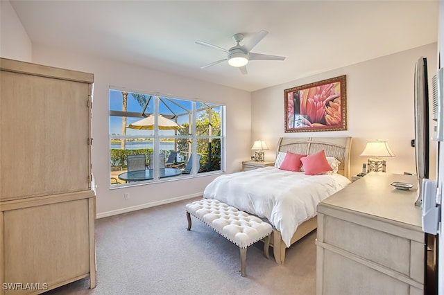 bedroom featuring ceiling fan and carpet