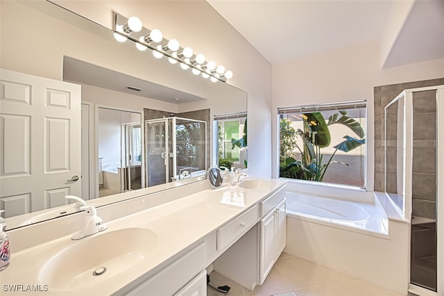 bathroom with shower with separate bathtub, tile patterned floors, and vanity