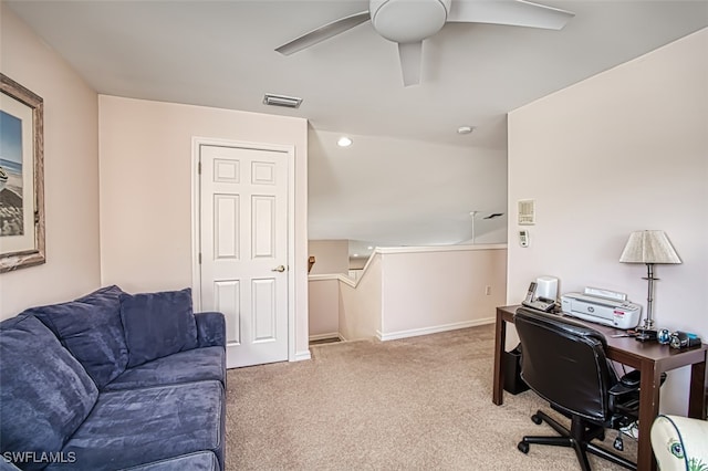 carpeted office featuring ceiling fan