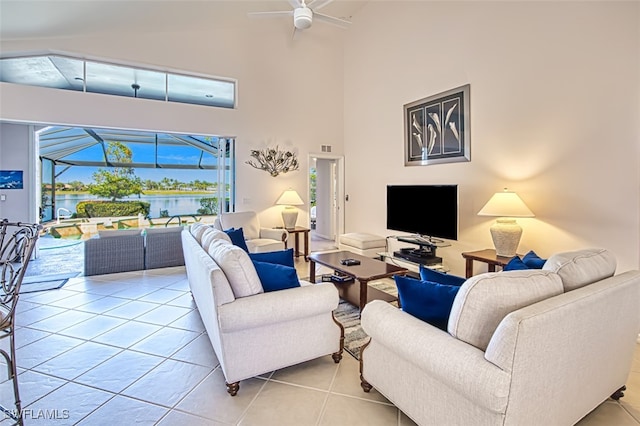 living room with high vaulted ceiling, light tile patterned floors, and ceiling fan