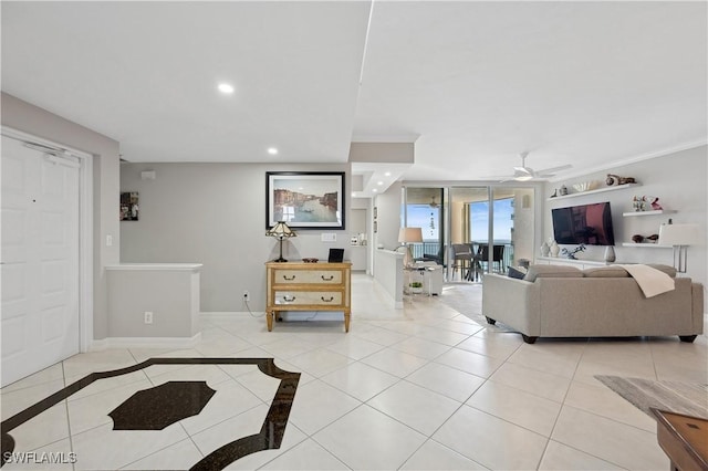 tiled living room featuring crown molding and ceiling fan