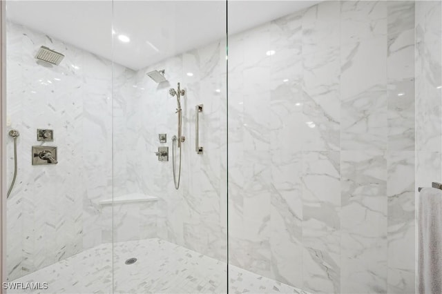 bathroom with tiled shower