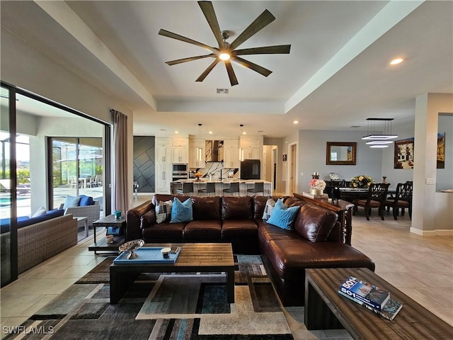 11637 Russet Trl, Fort Myers, FL 33913 - living area featuring ceiling fan, a raised ceiling, baseboards, visible vents, and recessed lighting