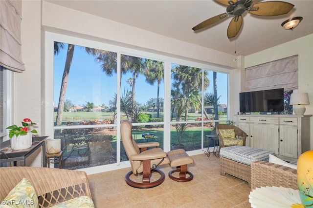 tiled living room featuring ceiling fan