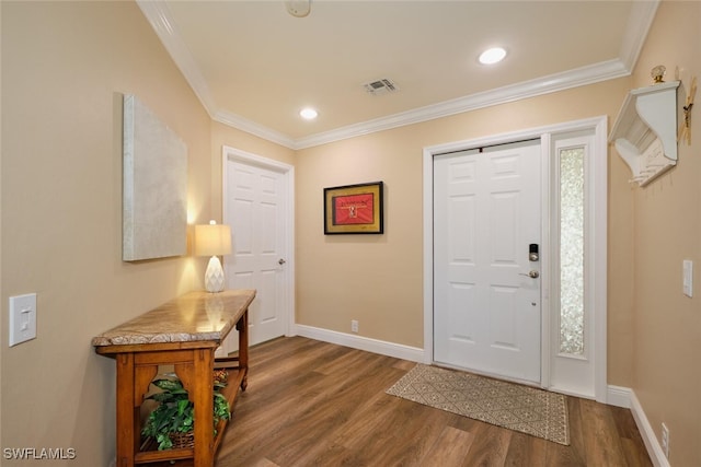 entrance foyer featuring hardwood / wood-style floors and ornamental molding