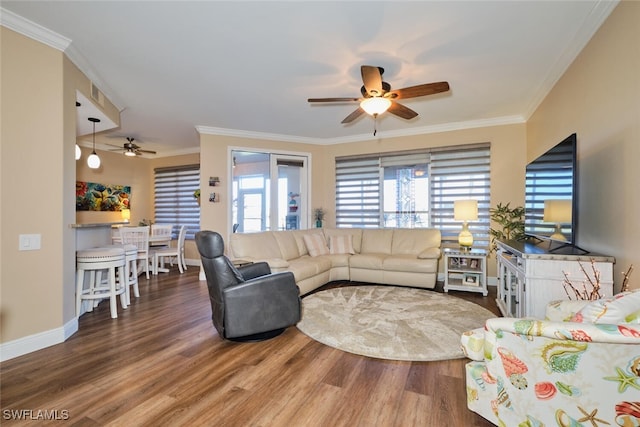 living room featuring crown molding, hardwood / wood-style flooring, and ceiling fan