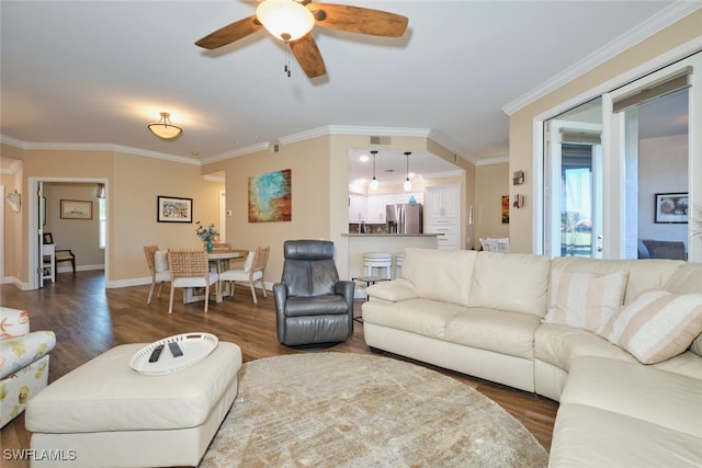 living room featuring crown molding, ceiling fan, and hardwood / wood-style floors