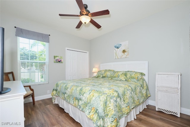 bedroom featuring dark wood-type flooring, a closet, and ceiling fan