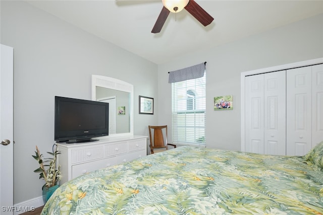 bedroom featuring ceiling fan and a closet