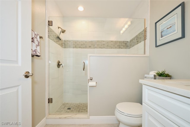 bathroom with vanity, an enclosed shower, and toilet