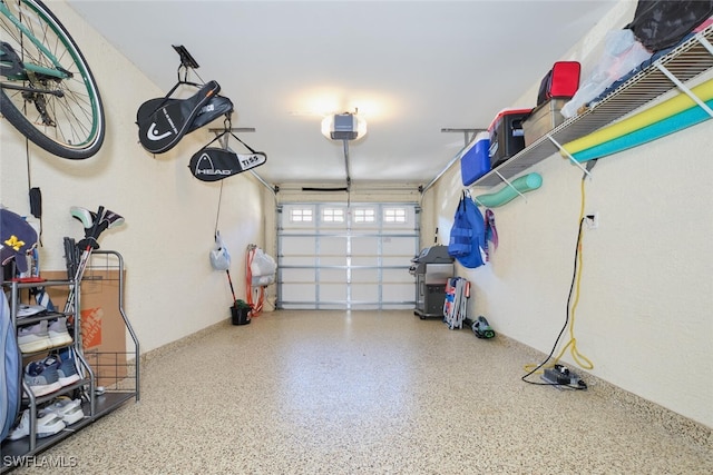 garage featuring a garage door opener