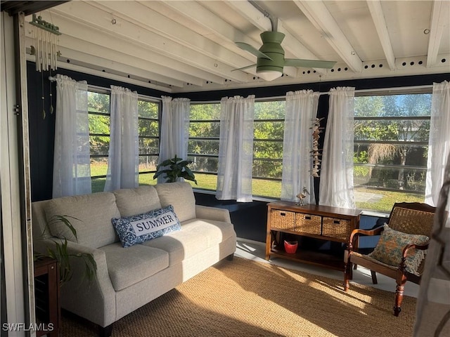 sunroom / solarium with beam ceiling and ceiling fan