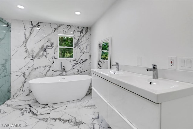 bathroom featuring vanity and plus walk in shower