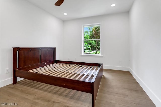 unfurnished bedroom featuring ceiling fan and light wood-type flooring