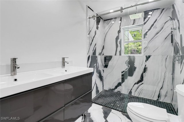 bathroom featuring walk in shower, vanity, and toilet