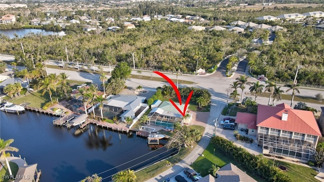bird's eye view featuring a residential view and a water view