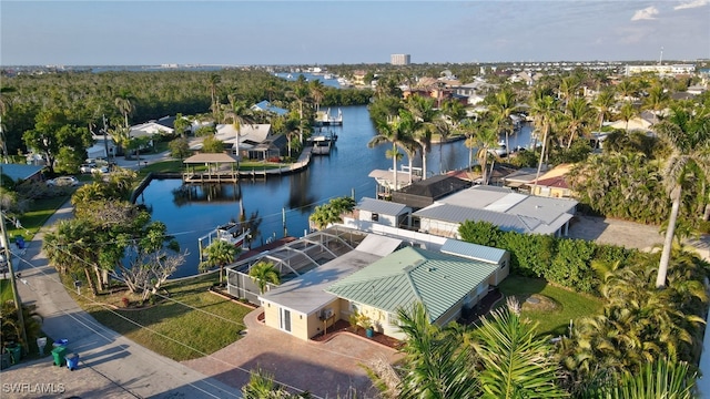 drone / aerial view with a water view and a residential view