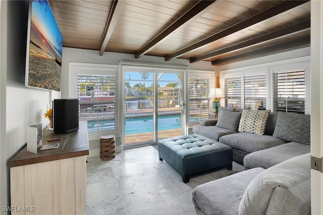 living area with beam ceiling