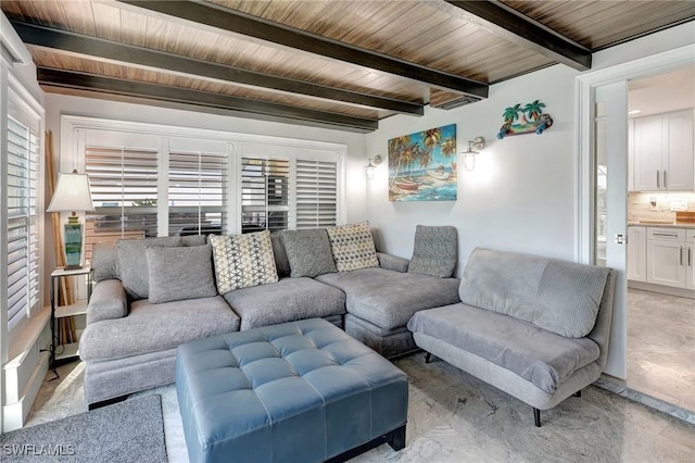 living area featuring beamed ceiling