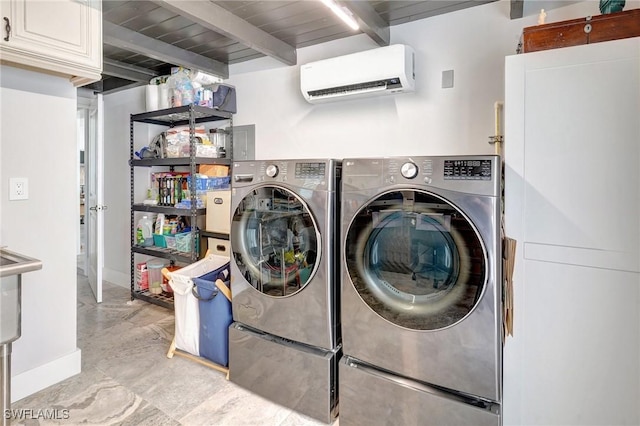 laundry area featuring cabinet space, washer and dryer, a wall mounted AC, and baseboards