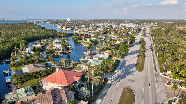 birds eye view of property with a residential view and a water view