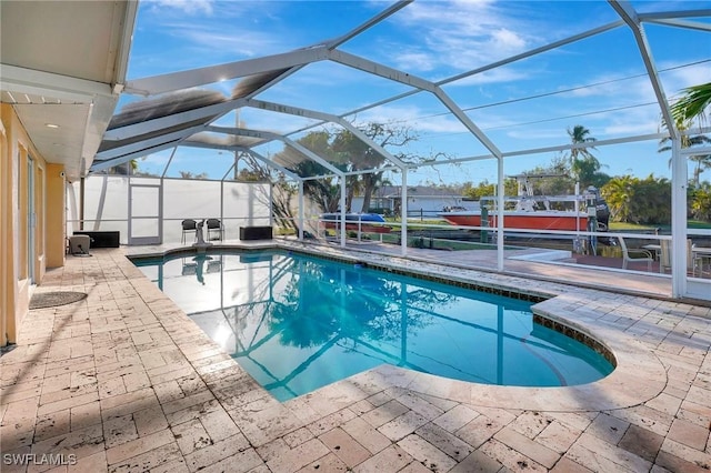 pool with a patio area and a lanai
