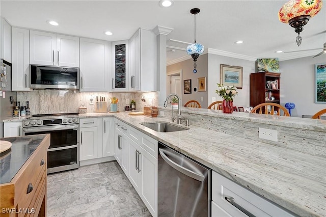 kitchen featuring a sink, recessed lighting, marble finish floor, and stainless steel appliances